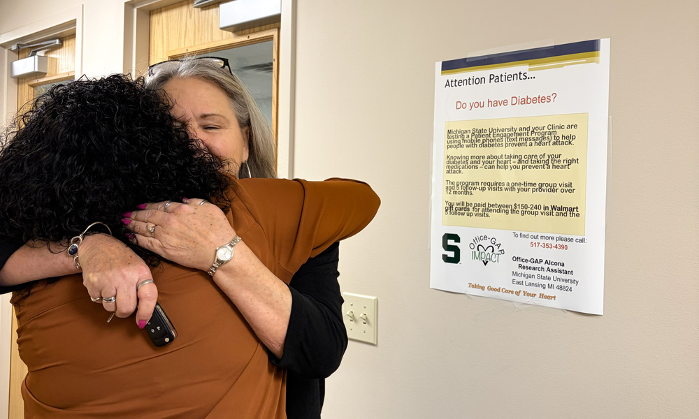 Jane Hiske and Sandy Samp hugging
