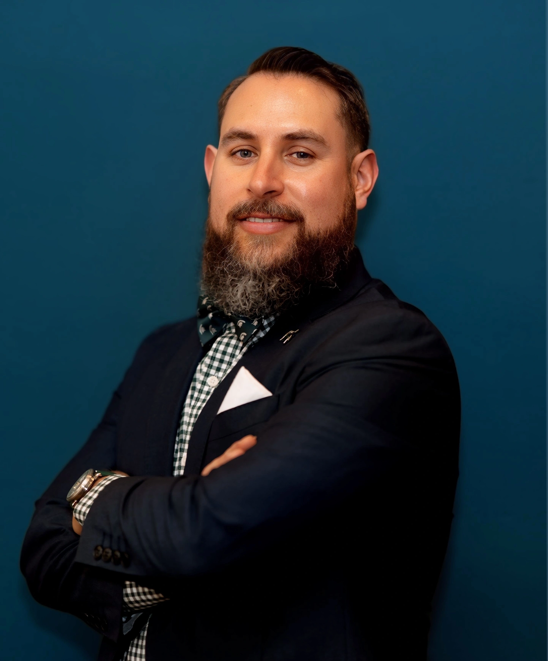 a bearded man wearing a sports coat