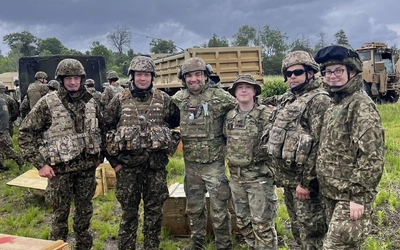 Liam McDonald standing with five other comrades during National Guard training.