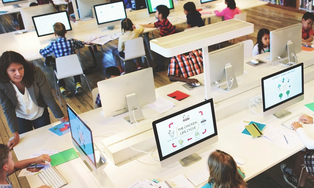Children learning at computers.