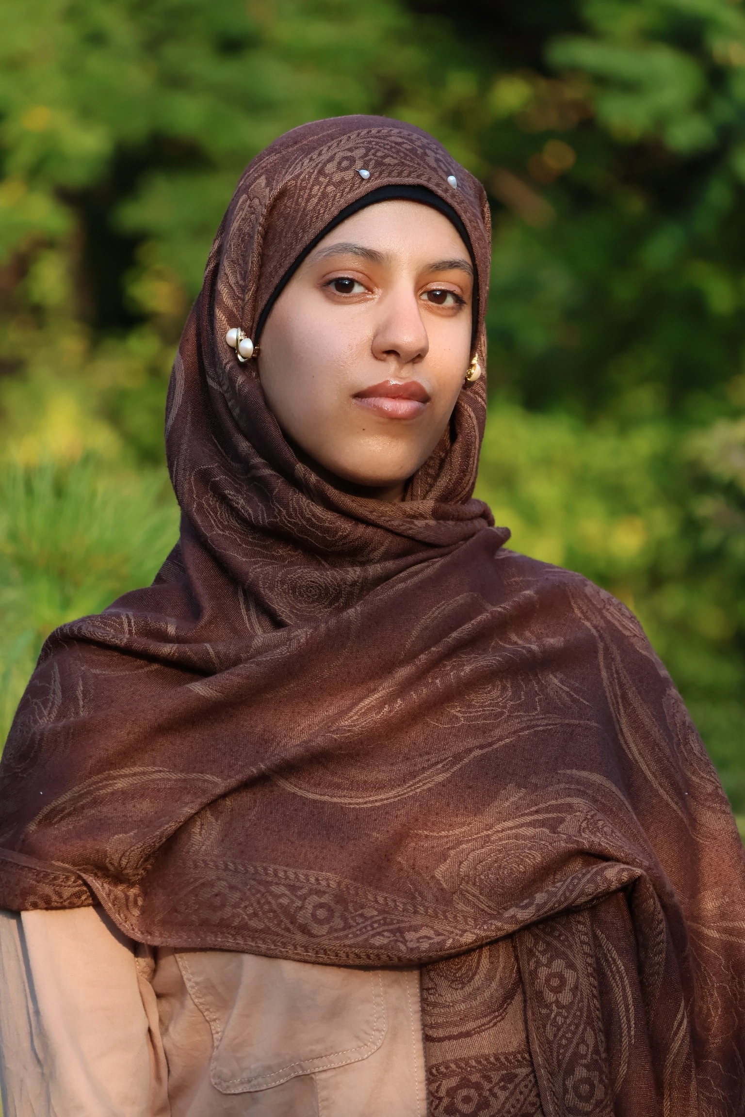 A woman in a traditional dress with a head scarf