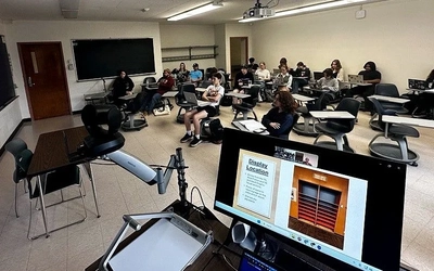 An image from the front of Julian Chambliss’ Readings in Graphic Narratives class full of students when the Capital Area District Libraries project was discussed.