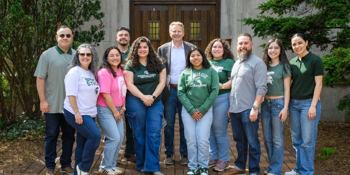 Farmworker Student Services staff and College Assistant Migrant Program scholars join President Kevin M. Guskiewicz, Ph.D., in recognition of #DenimDay. Photo by Dane Robison.