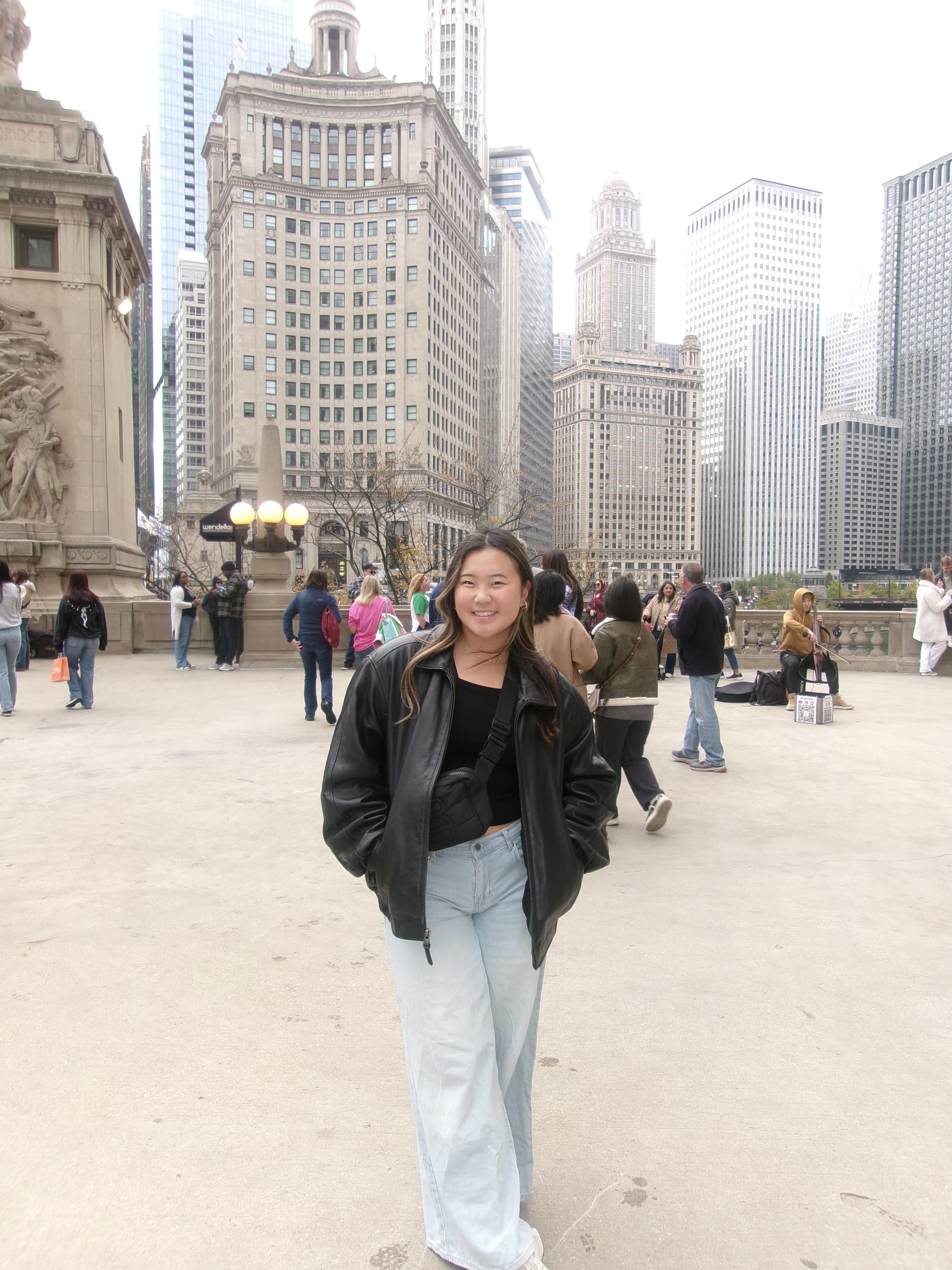 a woman stands in a city