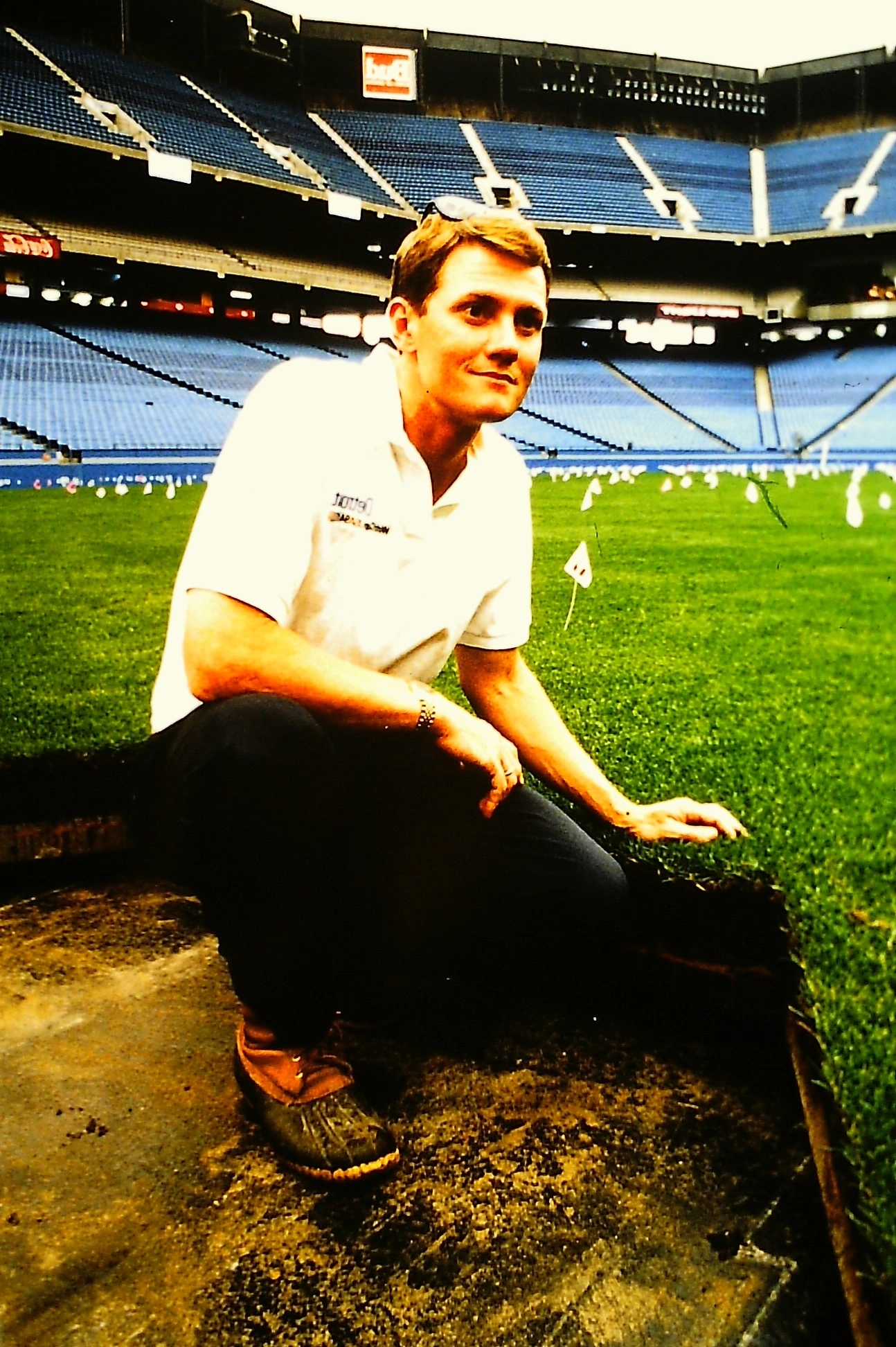 John 'Trey' Rogers III inspecting the indoor turfgrass field at the Pontiac Silverdome in the early 1990s.