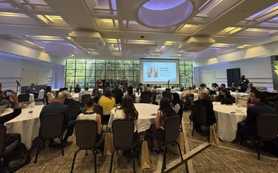 People watching a presentation at a conference.