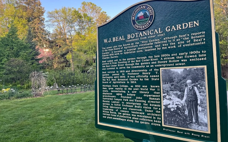 The Beal Botanical Garden historical marker with a photo of William J. Beal in the garden