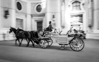 A black and white picture of a horse-drawn carriage in Austria.