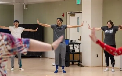 Bojan Lazarov demonstrates dance movements during a residency at MSU.