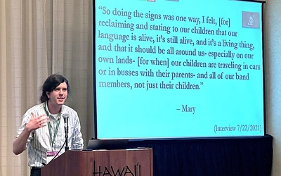 Dr. Elan Pochedley presenting at the 2024 Association of American Geographers Annual Meeting.