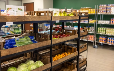Fresh produce on shelves at a food pantry
