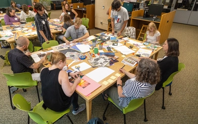 Participants in the MSU Holocaust and Genocide Fellowship program partake in a group activity regarding genocide education.