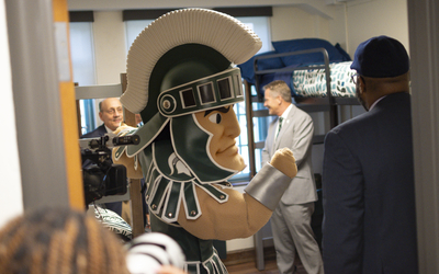 Sparty in a residence hall room at MSU