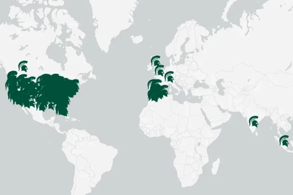World map with multiple green Spartan helmets covering the United States and Spain as well as other green Spartan helmets in Canada, United Kingdom, Milan and India.