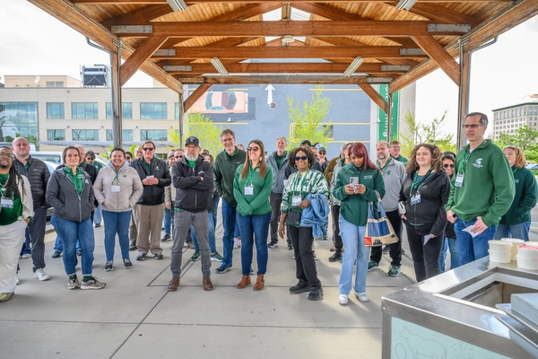 Spartan Bus Tour participants gather at the Flint Farmers' Market