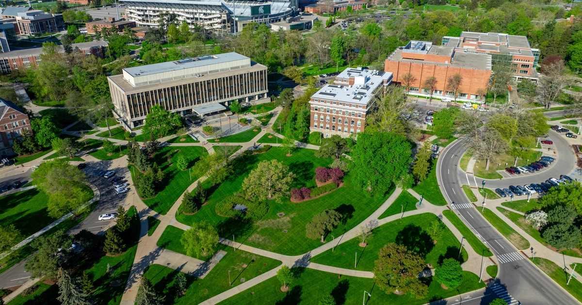 Aerial view of campus including the John A Hannah Administration Building and Olds Hall.