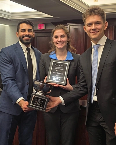 Katherine Held, Prabhjit Sangha and Jack Halford with awards from the Shapero Cup