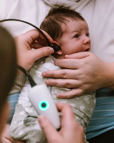 Newborn getting a hearing exam