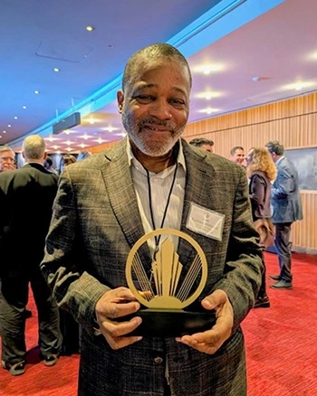 Professor of Jazz Bass Rodney Whitaker with trophy.