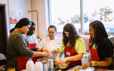 Kids in Flint learning how to cook.
