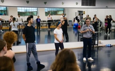 Bojan Lazarov demonstrates dance movements during a residency at MSU.
