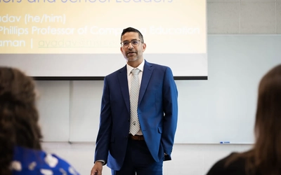Aman Yadav presents at a conference.
