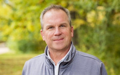Headshot of John Carlson.