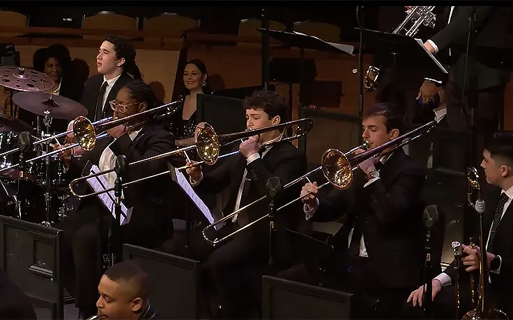 Members of MSU Jazz Orchestra 1 trombone section, Lexi Hamner, Miles Cole, Charles Scanlan, and Aidan Clark