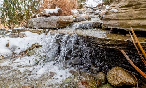 waterfall, located behind the Radiology building on a winter day